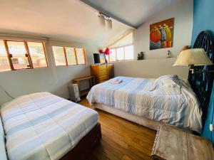 Postel nebo postele na pokoji v ubytování Flying Dog Hostel Cusco