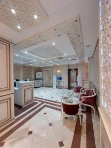 a large room with a kitchen and a living room at MUGHAN PARK HOTEL in Sabirabad