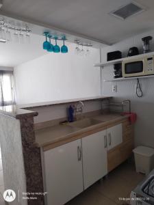 Кухня або міні-кухня у Apartamento Portinho