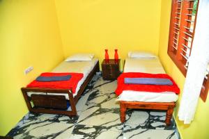 Ένα ή περισσότερα κρεβάτια σε δωμάτιο στο GoodVibes Homestay - Water Stream & Estate