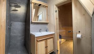 a bathroom with a sink and a shower at Apartament Krystynka Krywań in Poronin +12 photos