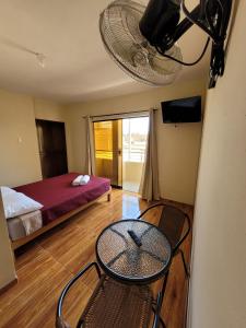 En eller flere senge i et værelse på Hospedaje La Posada del Chino