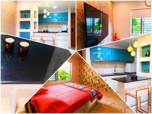 una cocina con armarios azules y una cama roja. en Gangothri en Thiruvananthapuram