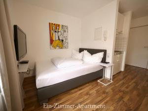 Posteľ alebo postele v izbe v ubytovaní Astoria Apartments