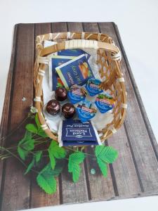 a basket of chocolates and other snacks on a table at Apartments im Taunus in Neu-Anspach