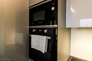 Kuchyňa alebo kuchynka v ubytovaní D Apartments Centrum Ogień