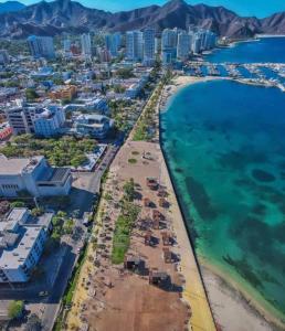 an aerial view of a beach and the ocean at Hotel Costa Norte in Santa Marta