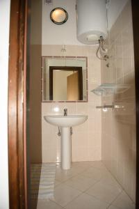 a bathroom with a sink and a mirror at Villa Claudia Lemon Appartment in Premantura +53 photos