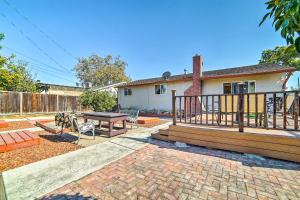 a patio with a table and a deck at Pet Friendly Santa Clara Home 6 Mi to San Jose! in Santa Clara