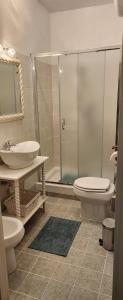 a bathroom with a shower and a toilet and a sink at Chic 'N Charme Trastevere Terrace in Rome