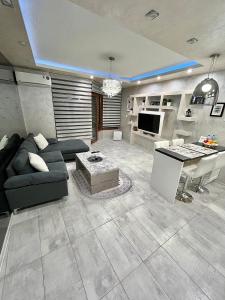 a large living room with a couch and a table at Elegant Stay in the Heart of Plovdiv Old Town in Plovdiv