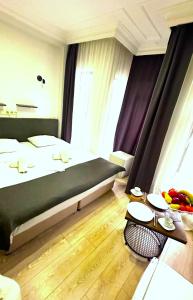 Säng eller sängar i ett rum på Altun Life Istanbul Hotel Oldcity