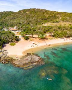 an aerial view of a beach with people on it at Le Village Boutique Hotel in Búzios