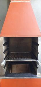 a empty bench with an orange roof on top at Apt 2 quartos, 5 pessoas em Container House in São Francisco do Sul