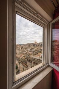 a window with a view of a city at Casa Adelina nel Centro dei Sassi in Matera