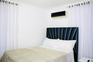 Una cama o camas en una habitación de Apartamento Los Rieles