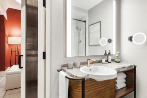 a bathroom with a sink and a mirror at Fairmont Banff Springs in Banff