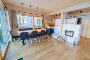 a kitchen and dining room with a table and chairs at Chalet Bavaria in Sankt Lorenzen ob Murau