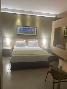 Cama o camas de una habitación en Hot-Springs apartamento hotel com banheira