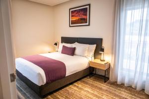 Postel nebo postele na pokoji v ubytování Porter's Plainland Hotel