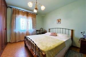 Ένα ή περισσότερα κρεβάτια σε δωμάτιο στο Casa Lepri