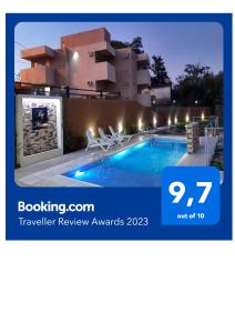 a villa with a swimming pool at night at By Muni Apartamentos Premium in Tanti