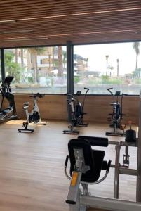 a gym with a bunch of exercise bikes in a room at Penthouse 2-Rooms with Private Jacuzzi in the Solarium in Orihuela Costa