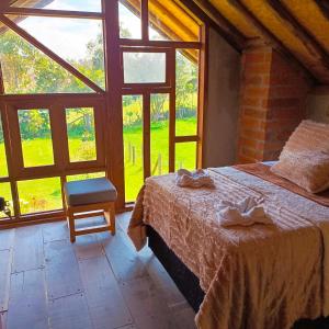 Voodi või voodid majutusasutuse Chalet del lago Santa Elena toas