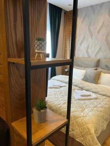 Łóżko lub łóżka w pokoju w obiekcie Modern Mountain II - Apartment 25