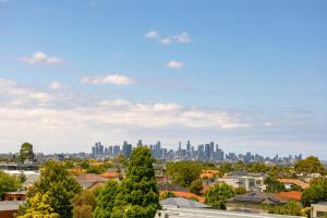 a view of a city skyline with buildings at Punthill Essendon North in Melbourne