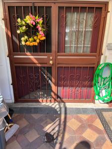 a door with a flower basket on it at Cozy Place To Stay in Brooklyn in Brooklyn