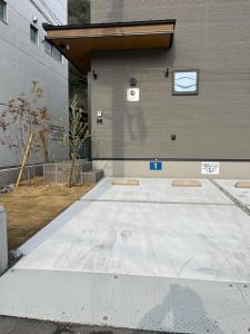 a building with a skate ramp in front of it at Second Home 瀬戸風月 in Takamatsu