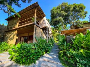 a house with a staircase leading up to it at VILA 335 Trancoso in Trancoso