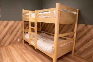 a couple of bunk beds in a room at Second Home 瀬戸風月 in Takamatsu +37 photos