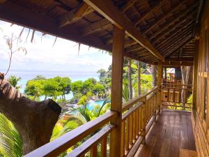 a porch of a resort with a view of the ocean at Phi Phi Phu Chalet Resort in Phi Phi Islands
