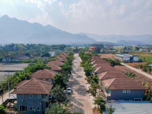 an aerial view of a village with houses at Happy Land Residence in Ban Nam Cham