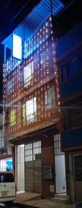 a building with christmas lights on the side of it at HOTEL DANUBIO in Bogotá