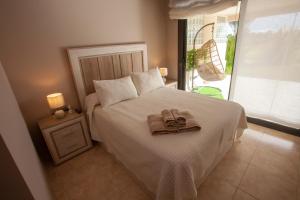 Postel nebo postele na pokoji v ubytování Destino Deluxe Valle del Este Vera + 23 fotografií