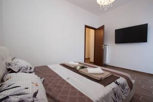 Ένα ή περισσότερα κρεβάτια σε δωμάτιο στο Residenza Alexander Luxury 1 +2 φωτογραφίες