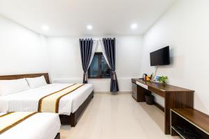 Voodi või voodid majutusasutuse Đà Lạt Cao Nguyên Hotel toas
