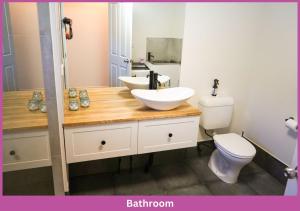a bathroom with a sink and a toilet at Strand Park Unit - U1 Ground floor in Townsville