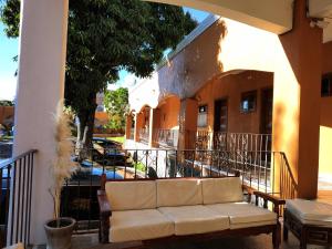 a couch sitting on the porch of a building at Ex Hacienda Santa Elena in Atlixco
