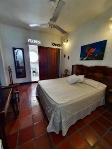 Postel nebo postele na pokoji v ubytování Hotel Casa de Las Palmas