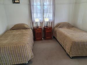 Postel nebo postele na pokoji v ubytování Parlour Mountain Cottage