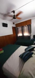 Een bed of bedden in een kamer bij Residencial Ariand