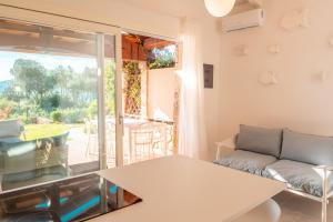 a living room with a table and a couch at Villa Valentina 250m From The Beach - Happy Rentals in Puntaldia