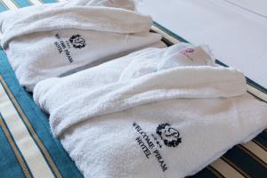 a group of towels sitting on a tray at Golden Tulip Rome Piram in Rome