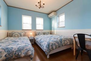 Letto o letti in una camera di Seaside House Enoshima 江ノ島, Free Parking 漫居湘南海岸, 尋訪灌籃高手