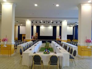 a conference room with a long table and chairs at Chiangkhong Teak Garden Riverfront Hotel in Chiang Khong +219 photos