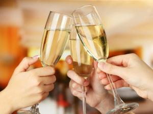 a group of people holding up champagne glasses at The BREAKFAST HOTEL Fukuoka Tenjin in Fukuoka